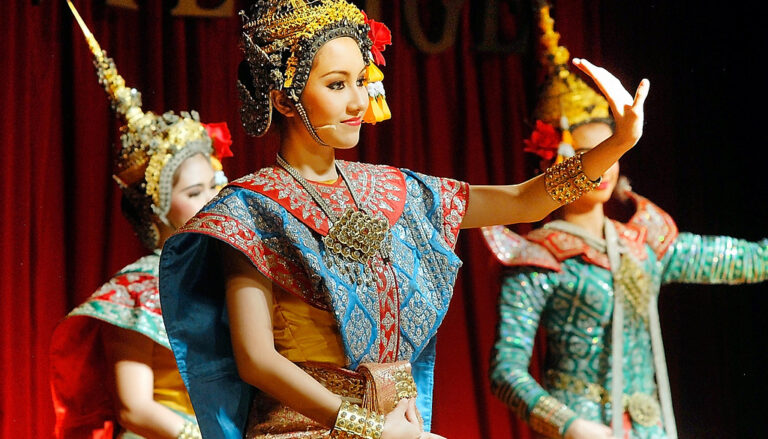 Traditional Thai dancers performing on stage — authentic cultural experiences for impactful team events.