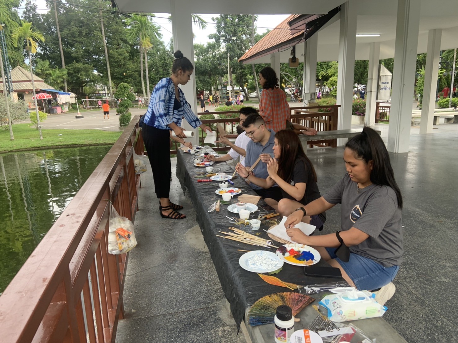 Creativity as a Foundation for Strong Teams Team participating in a creative workshop, painting and crafting together to strengthen collaboration.