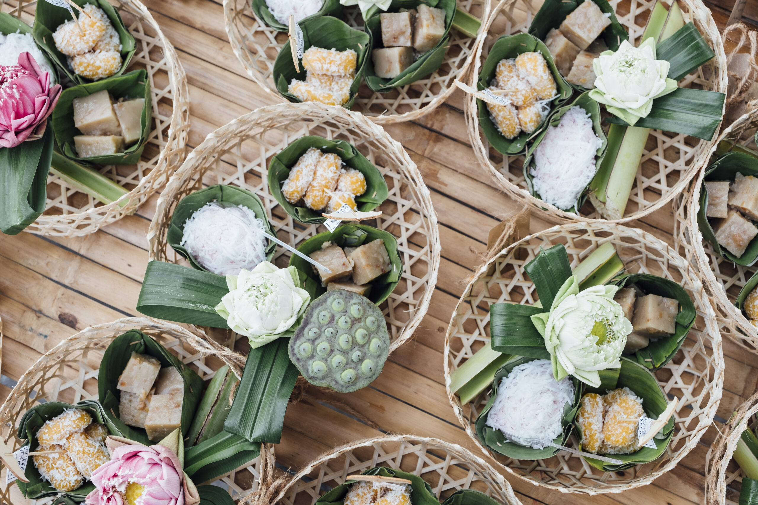 Thai snack and dessert in basket Traditional Thai offerings arranged in woven trays, symbolizing local knowledge and cultural understanding.