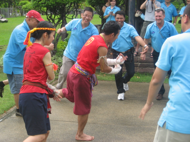 Real-Time Strategy and Decision Velocity Corporate team engaging in a dynamic outdoor Muay Thai challenge focused on real-time strategy and fast decision-making.