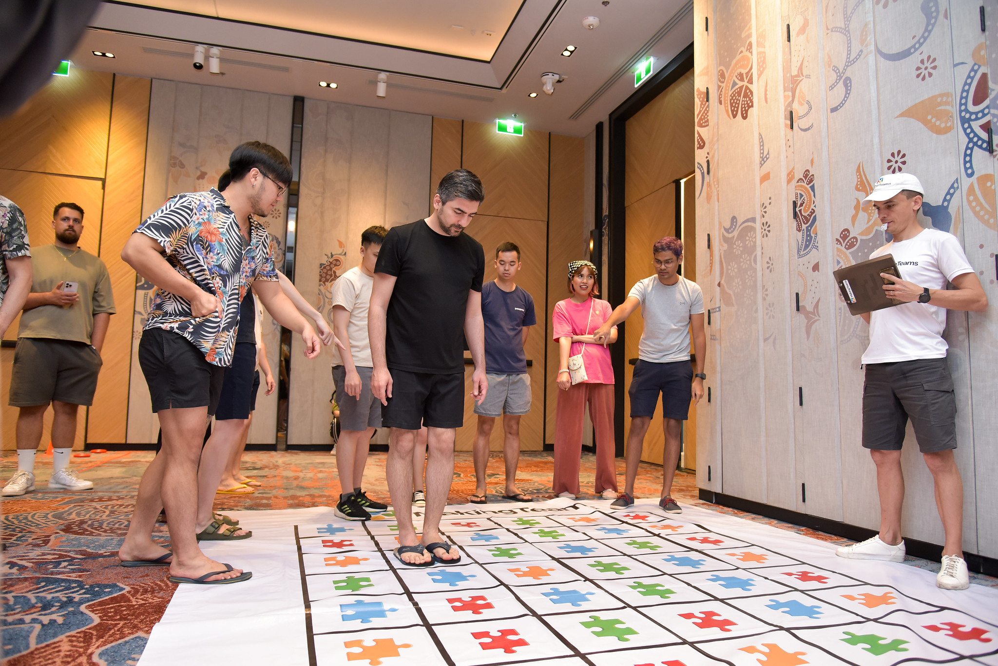 Strategic Decision-Making Games Corporate team navigating a large floor strategy game designed for high-impact simulation and decision-making training.