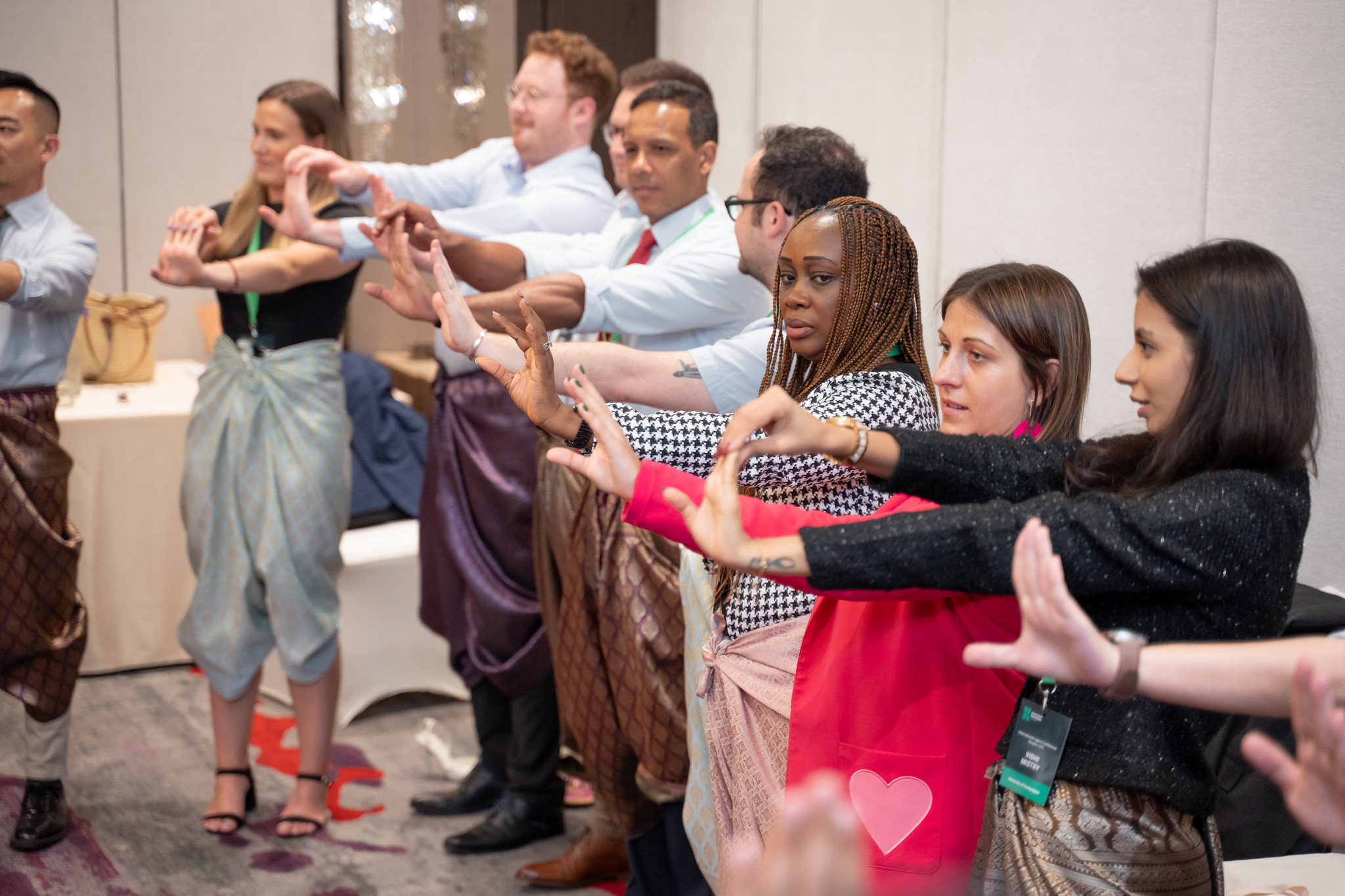 Breaking Barriers Through Playful Interaction Corporate participants engaging in interactive team building activity to break communication barriers