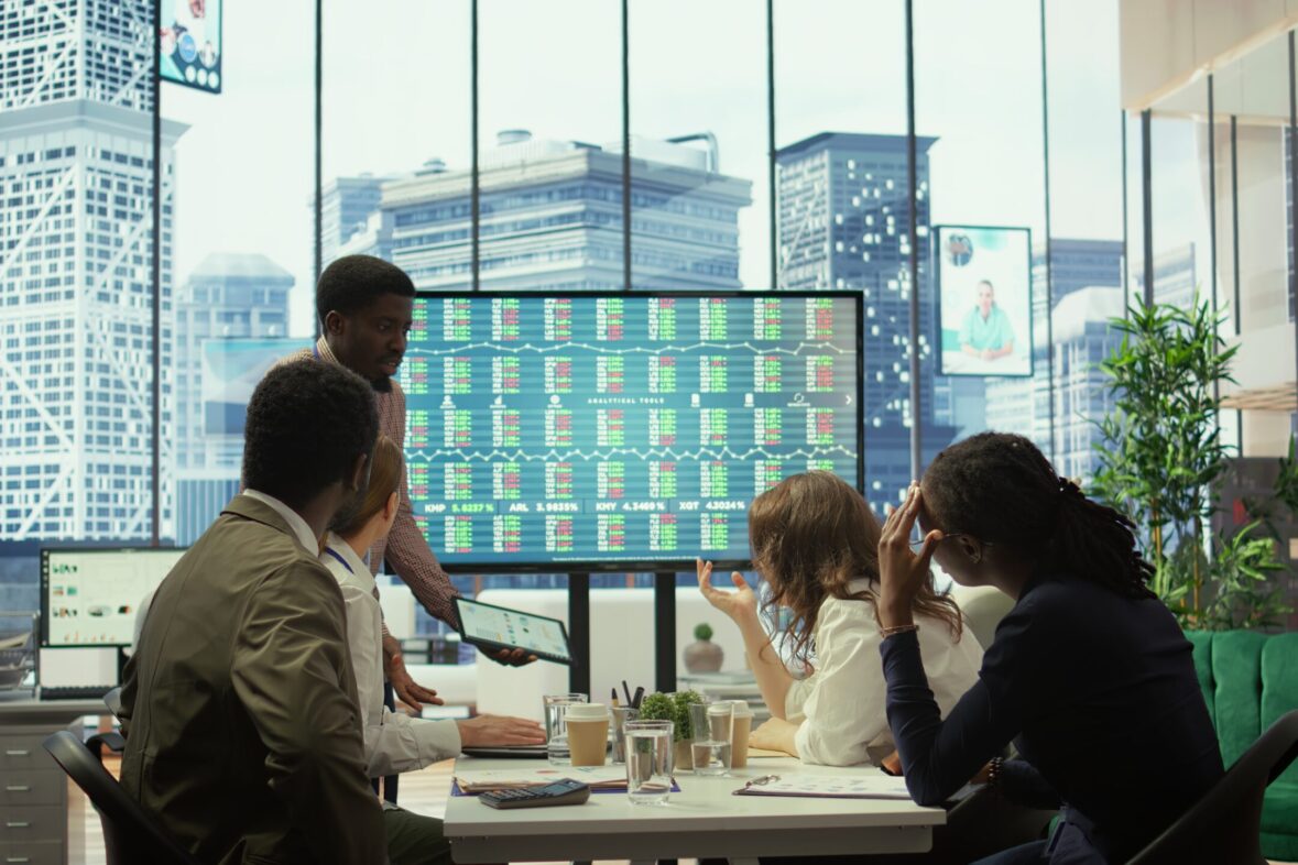 Corporate team analyzing data to highlight strategic value of destination management organization in Bangkok.
