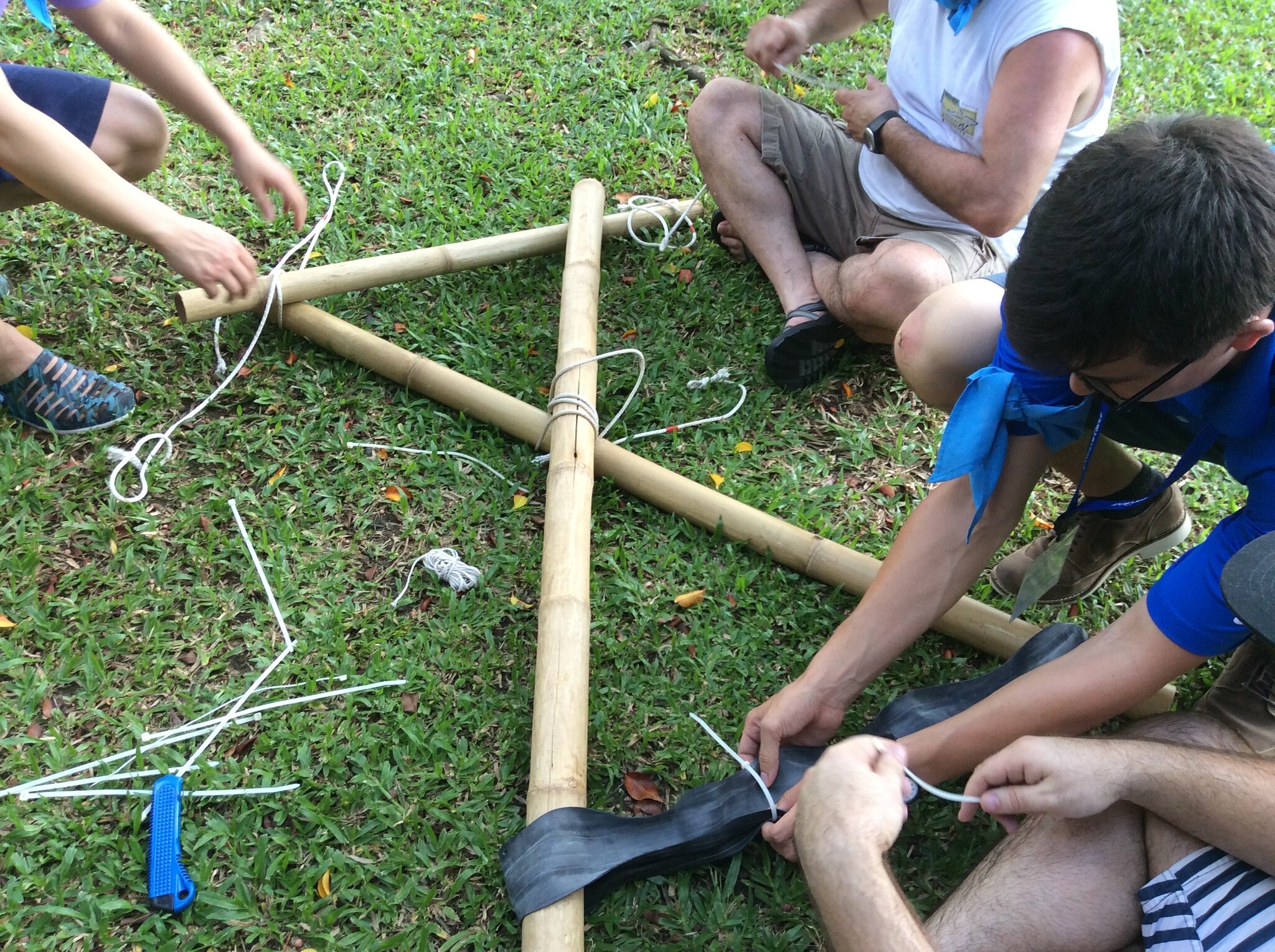 Engineering Collaboration Under Pressure Corporate participants working together on engineering-style team building task