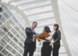 Business professionals planning cultural experiences with a destination management company in Kuala Lumpur