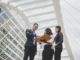 Business professionals planning cultural experiences with a destination management company in Kuala Lumpur