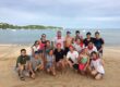 Corporate group after completing a beach trust team building program in Phuket focused on collaboration and trust