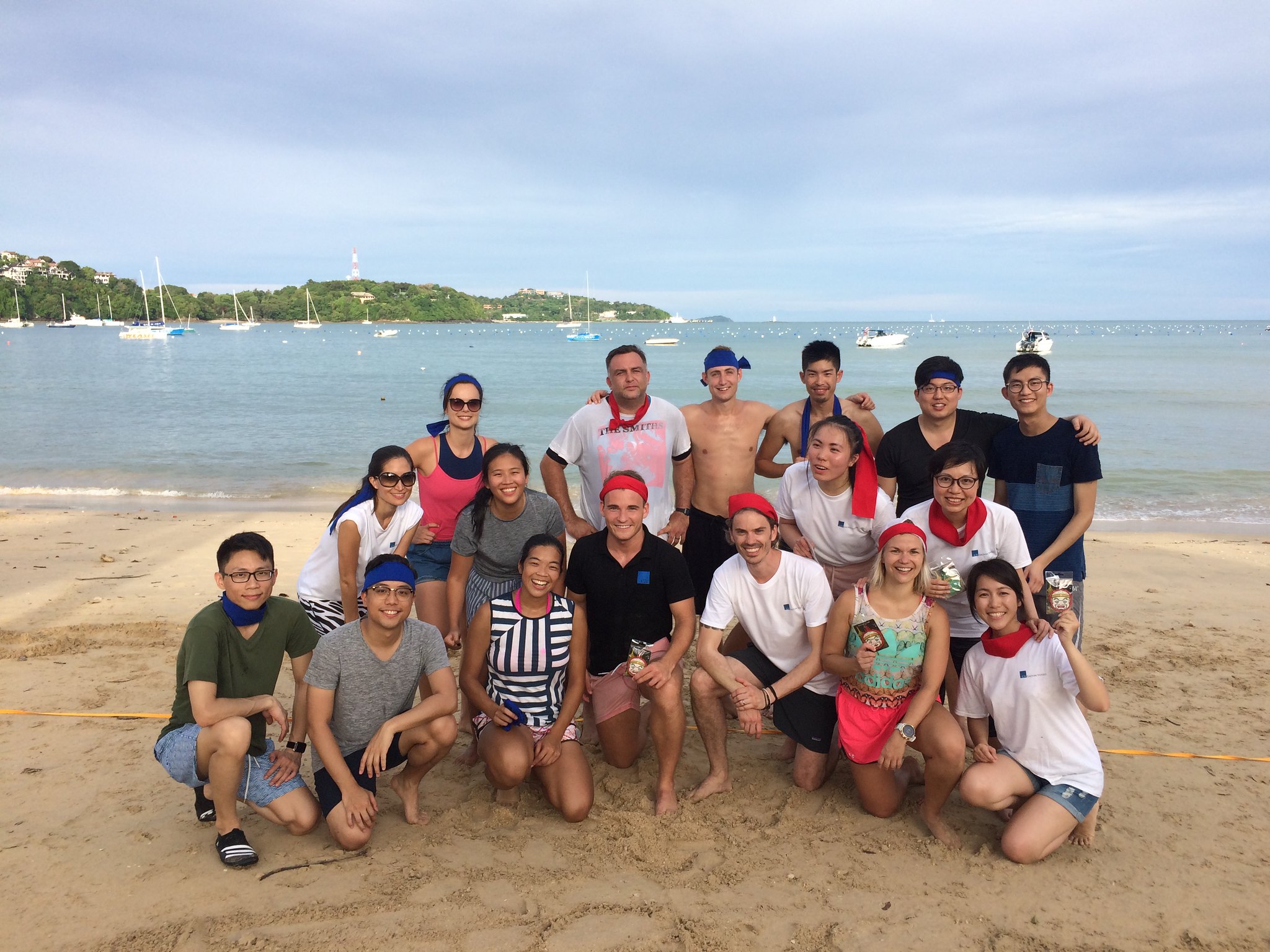 Corporate group after completing a beach trust team building program in Phuket focused on collaboration and trust