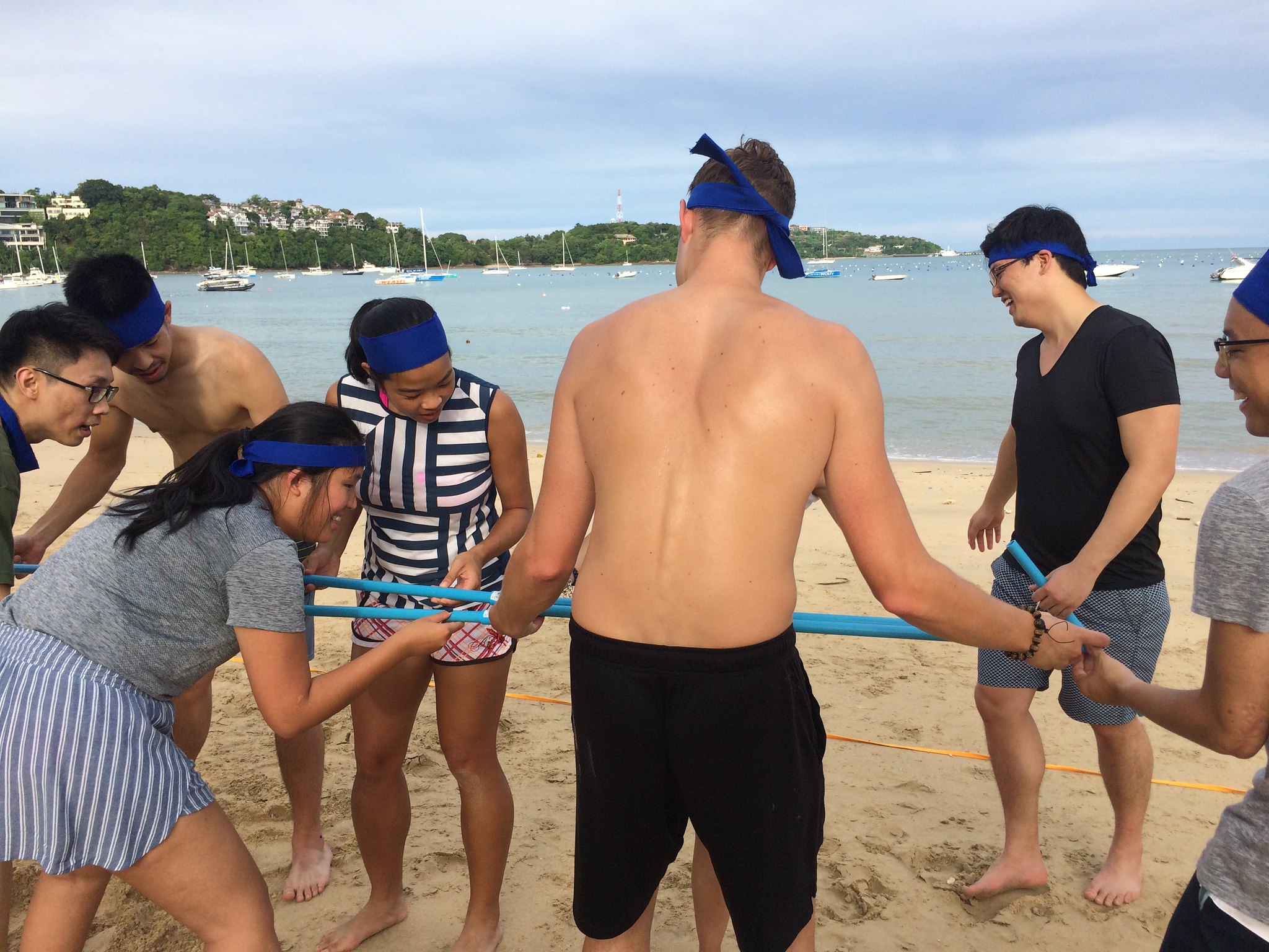 Trust, Support, and Shared Responsibility Beach team building activity in Phuket focused on trust, shared responsibility, and collaborative problem solving