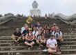 Corporate group exploring a Phuket landmark during a cultural discovery team building experience