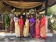 Corporate team experiencing Thai heritage in Phuket through traditional dress, cultural activities, and interactive team building