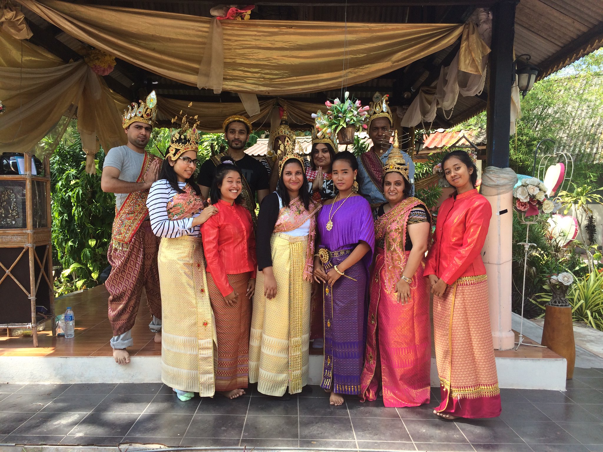 Experience Thai Heritage Through Interactive Team Building in Phuket Corporate team experiencing Thai heritage in Phuket through traditional dress, cultural activities, and interactive team building