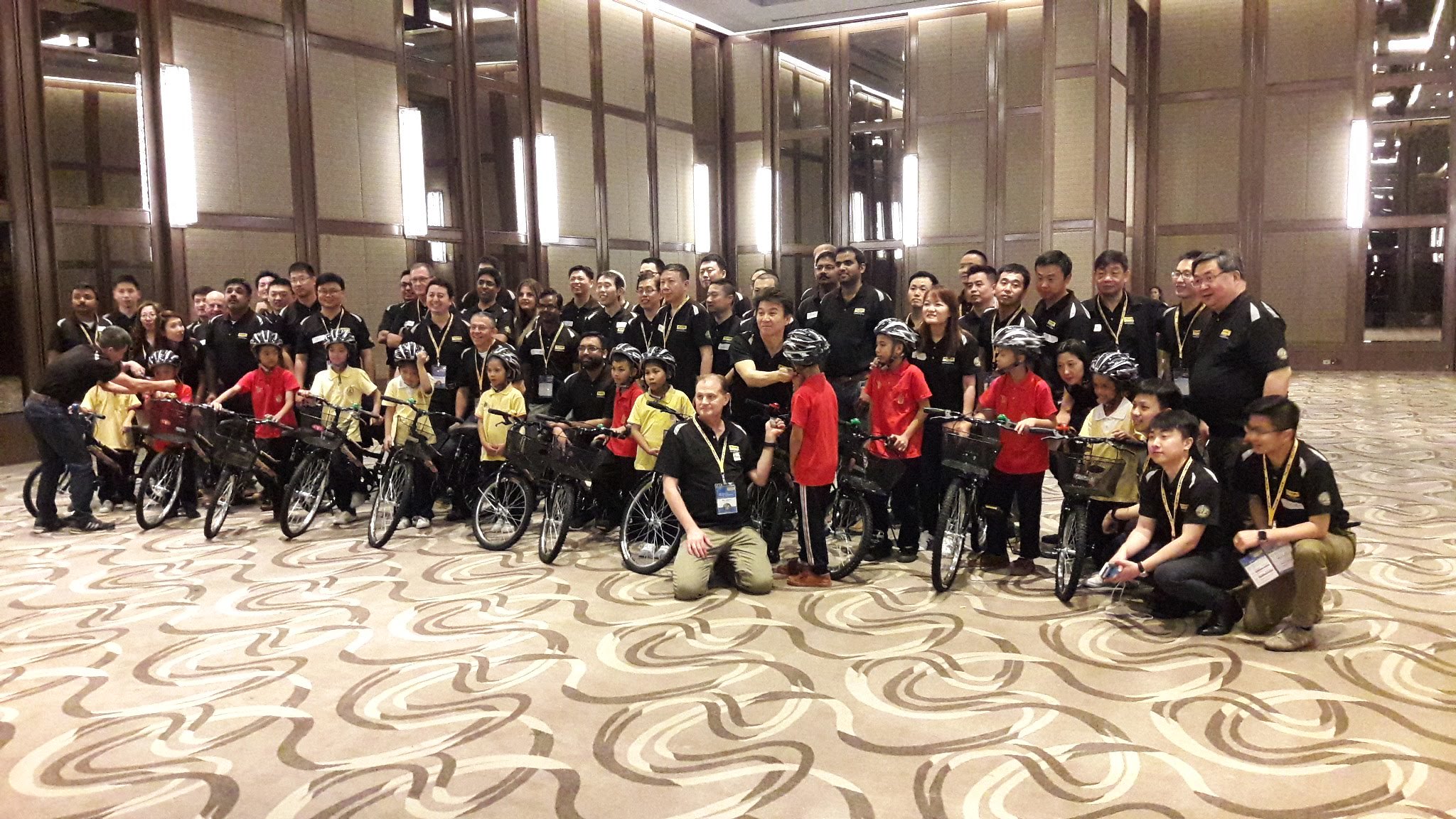 Hands-On Bike Assembly Team Building in Bangkok Corporate group completing a hands-on bike assembly team-building activity in Bangkok designed to strengthen teamwork and collaboration